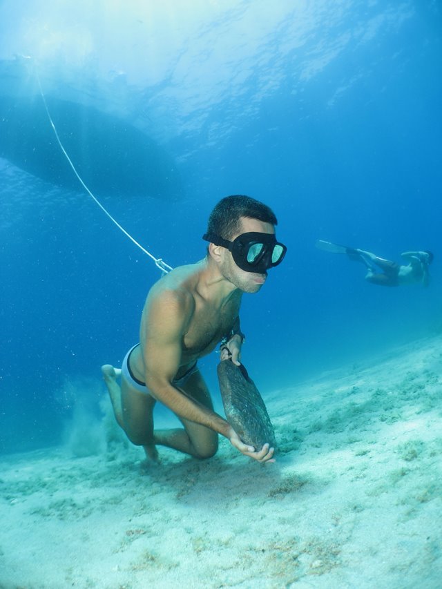 Freediver with a sponge diver